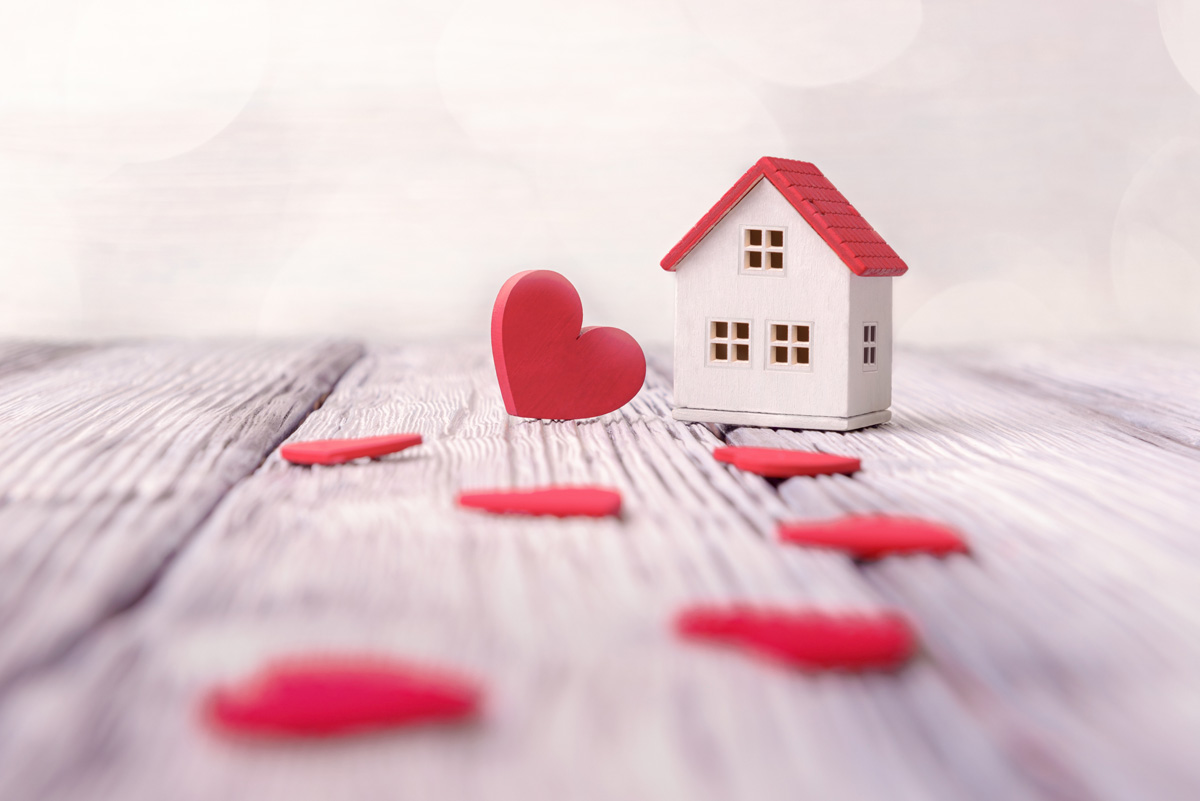 Little wooden house with red hearts